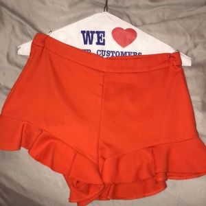 Orange ruffle shorts